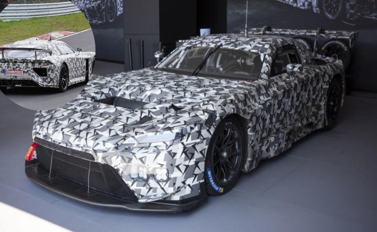 Camouflaged sports car in a garage with aerodynamic design.