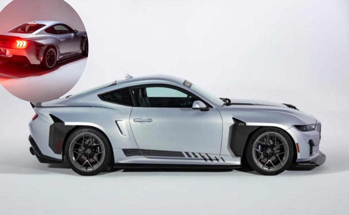 Sleek silver sports car with black rims and aerodynamic design.
