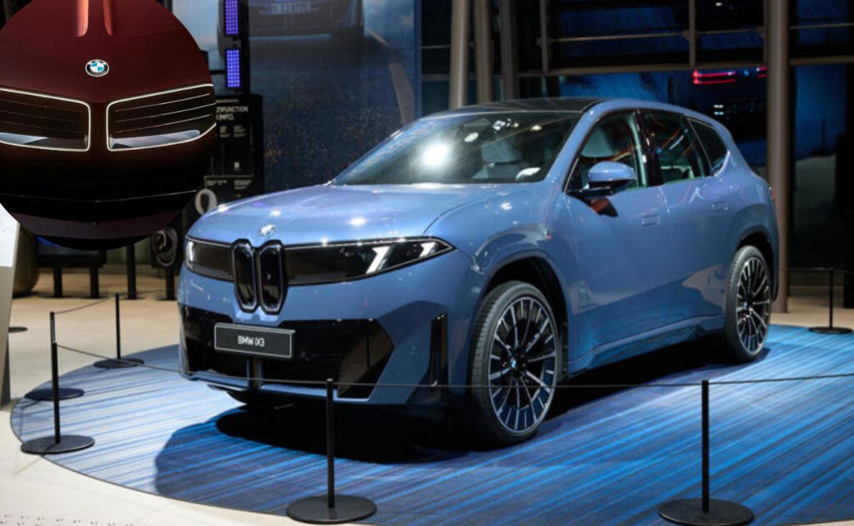 A sleek blue BMW iX electric SUV displayed indoors.