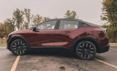 Sleek maroon compact SUV parked outdoors with black wheels.
