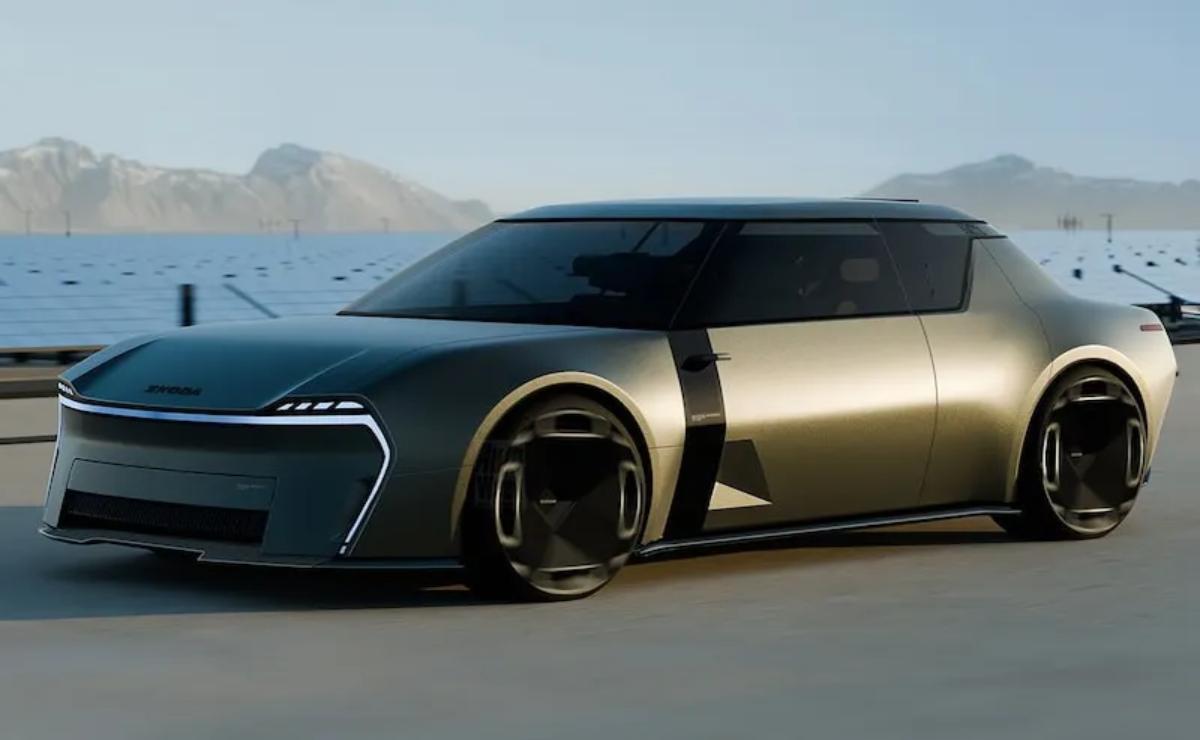 Futuristic concept car with sleek design by the water.