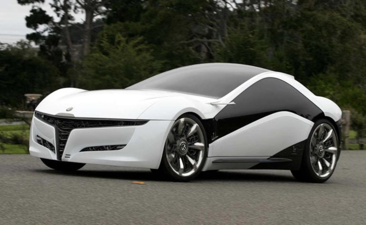 Sleek white futuristic concept car with aerodynamic design and large alloy wheels.