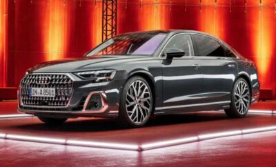 Sleek, modern luxury sedan under warm lighting.
