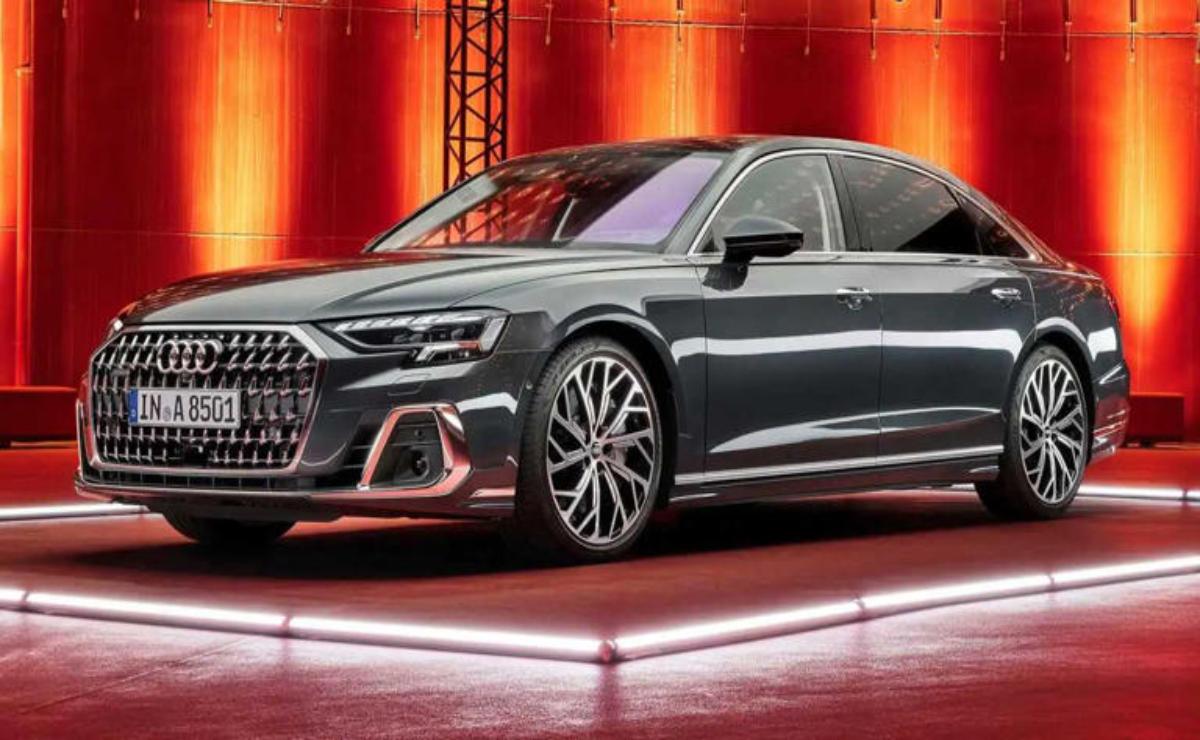 Sleek, modern luxury sedan under warm lighting.