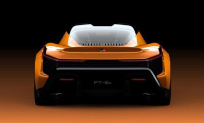 Rear view of an orange sports car with a prominent engine compartment.