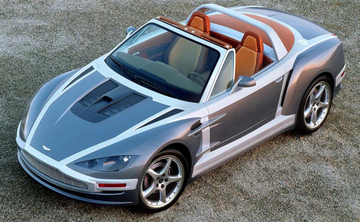Sleek silver convertible sports car with tan leather interior.