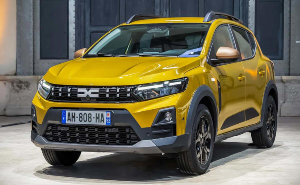 A yellow compact SUV parked outdoors near a building.