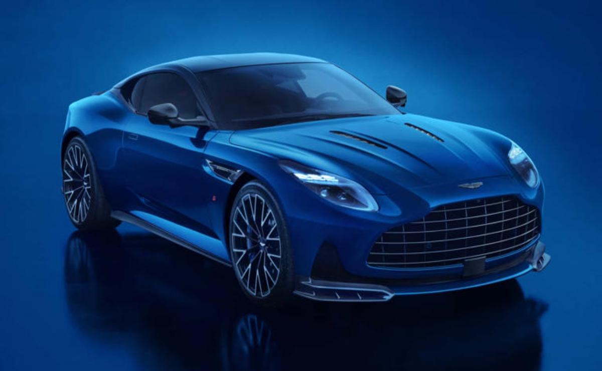 Sleek blue luxury sports car with modern design under blue lighting.