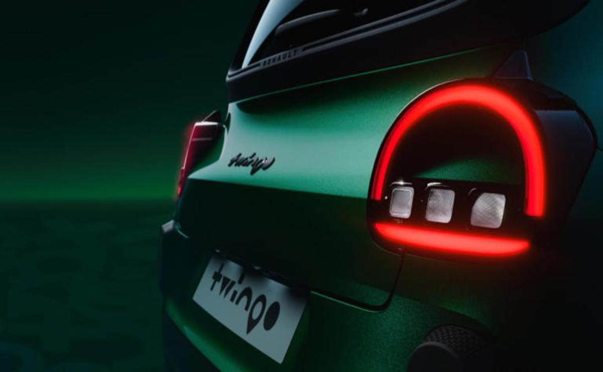 Close-up of a car's rear with illuminated taillights and a blurred license plate.