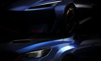 Close-up of a sleek blue sports car with sharp design details.