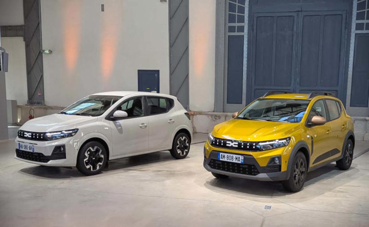 Two modern cars parked inside a well-lit showroom with minimalist decor.