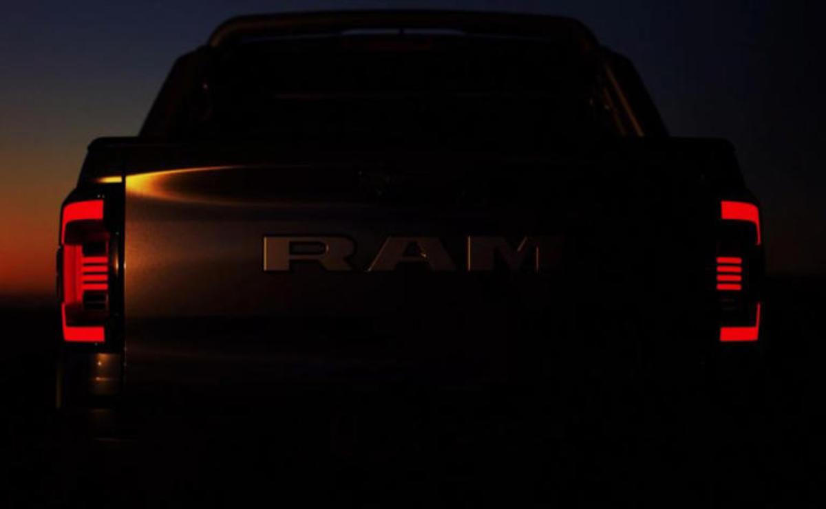Dark image showing the front of a RAM vehicle with faintly visible logo.