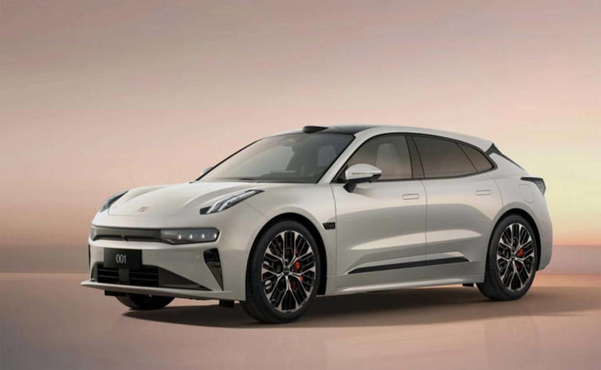 Sleek modern electric car with aerodynamic design and stylish black rims.