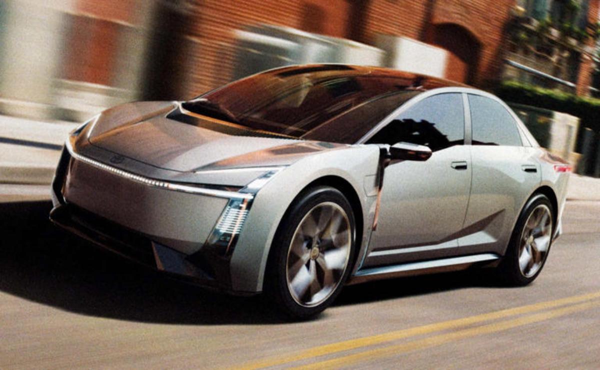 Sleek futuristic silver electric car driving on the road.