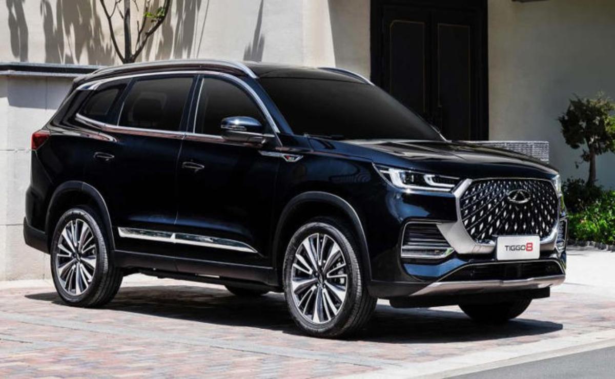 Sleek black luxury SUV parked on a modern driveway.