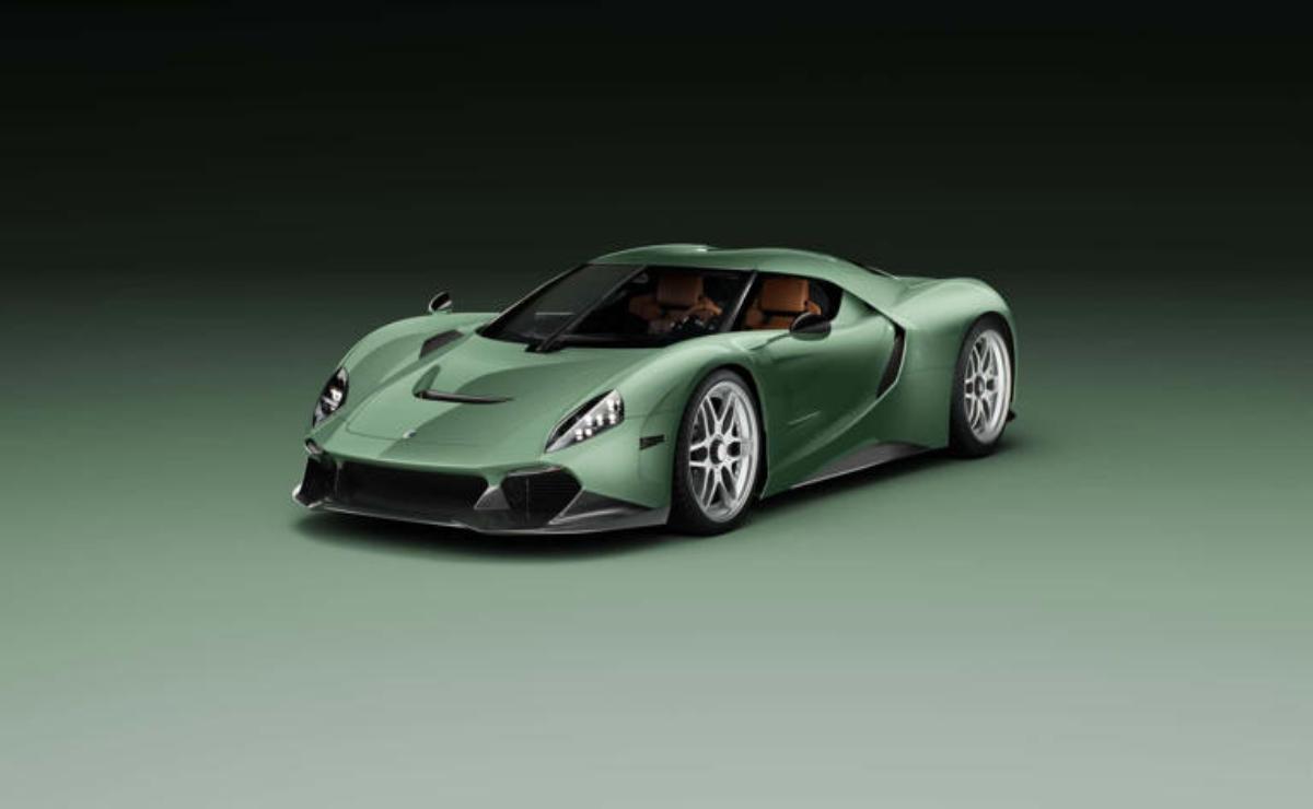 A sleek green sports car with aerodynamic design and silver rims.