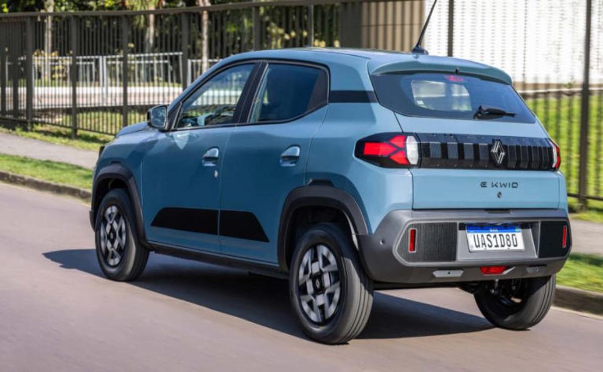 Compact blue SUV parked on the street under daylight.
