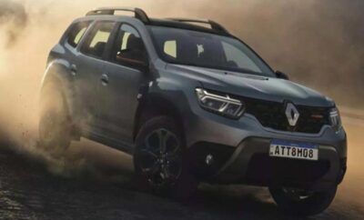 A dark gray Renault SUV parked on a rugged terrain.
