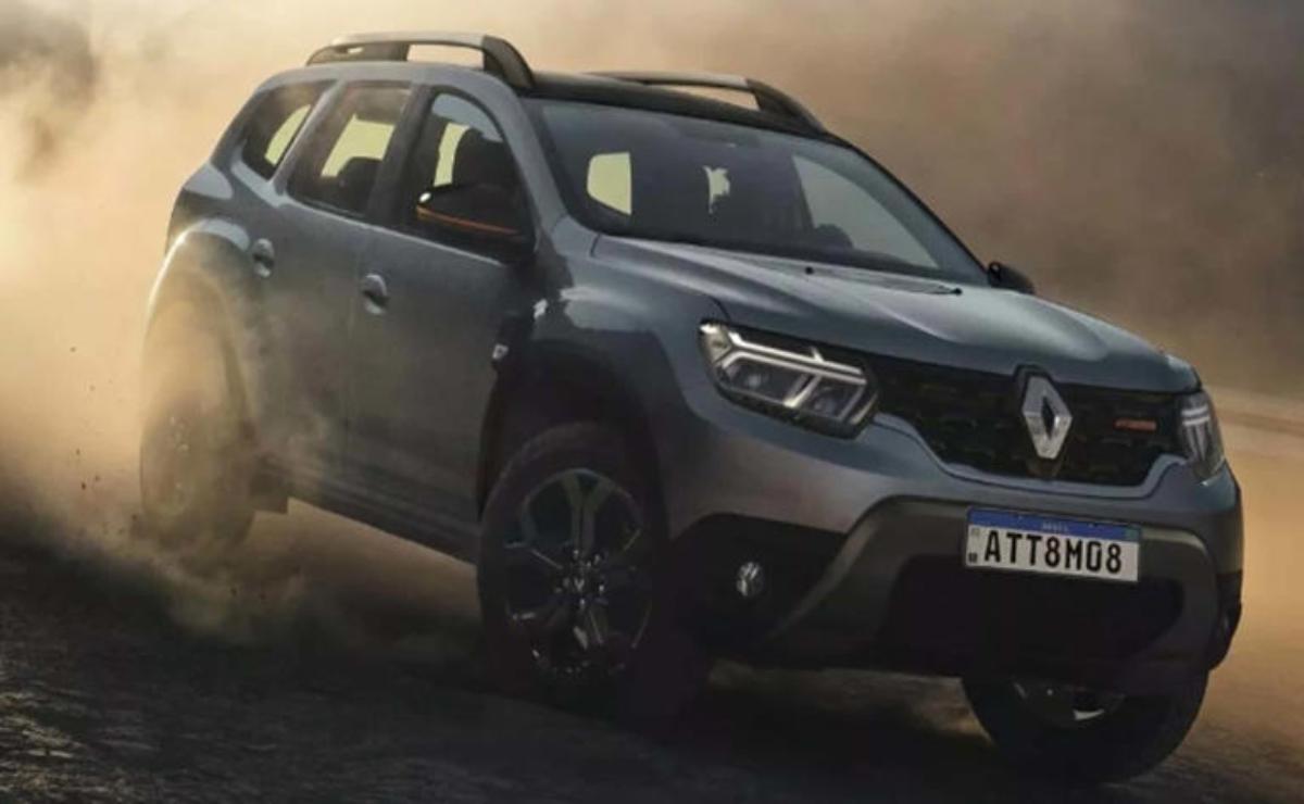 A dark gray Renault SUV parked on a rugged terrain.