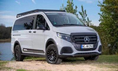 White Mercedes-Benz van parked outdoors on a sunny day.