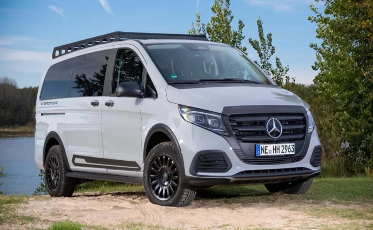 White Mercedes-Benz van parked outdoors on a sunny day.