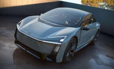 Sleek modern electric car in silver on display.