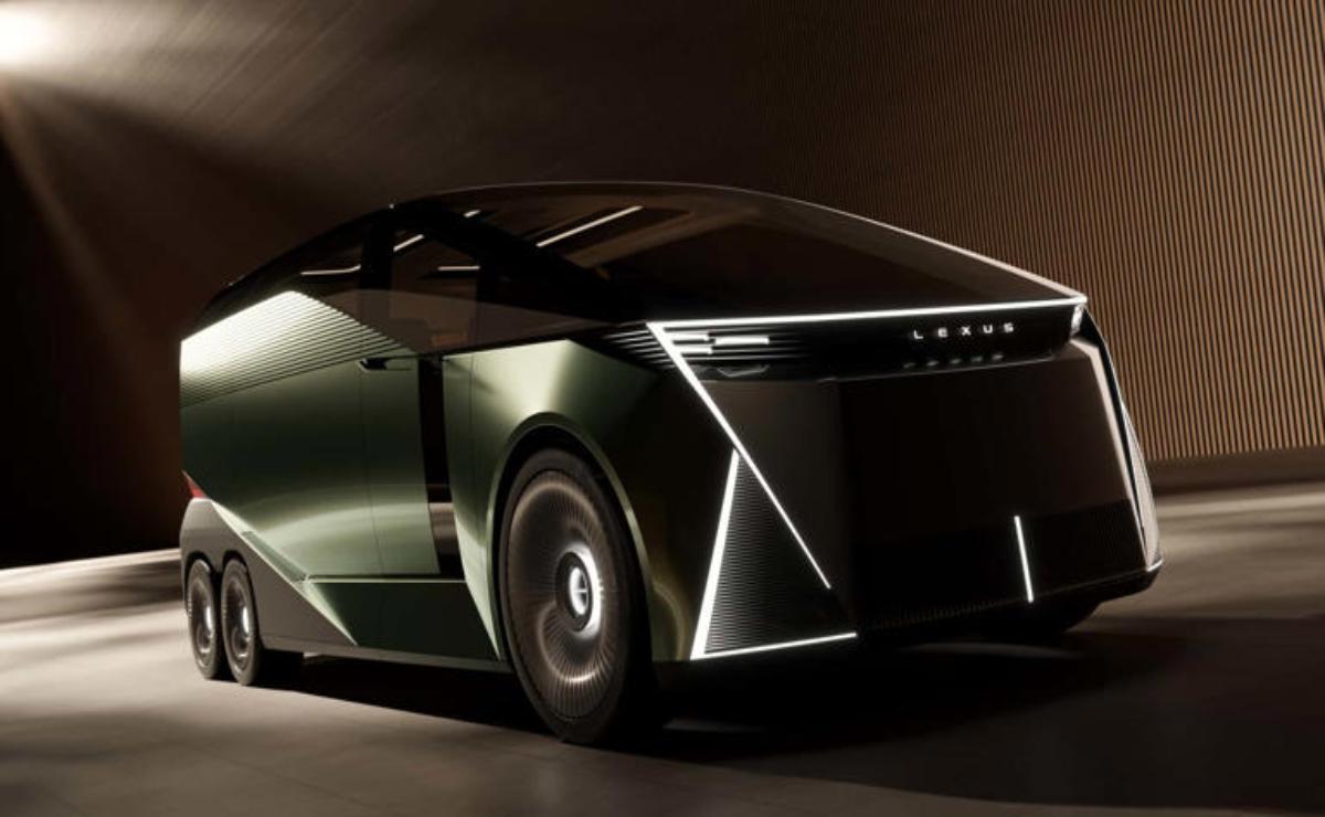 Futuristic electric car with sharp lines and LED lights in a dark setting.