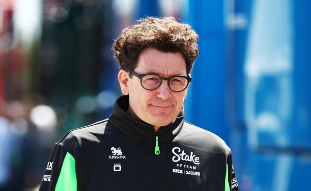 Man with glasses and curly hair wearing a black jacket.