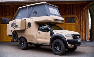A rugged off-road vehicle with a mounted camper setup for adventure travel.
