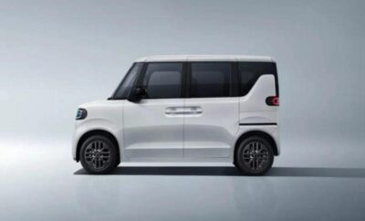 Sleek white compact car with modern design and black-tinted windows.