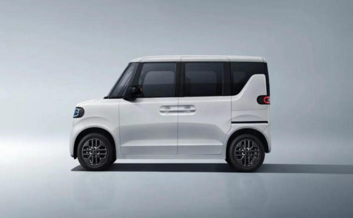 Sleek white compact car with modern design and black-tinted windows.