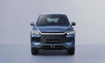 Front view of a sleek blue SUV with modern headlights and a bold grille.