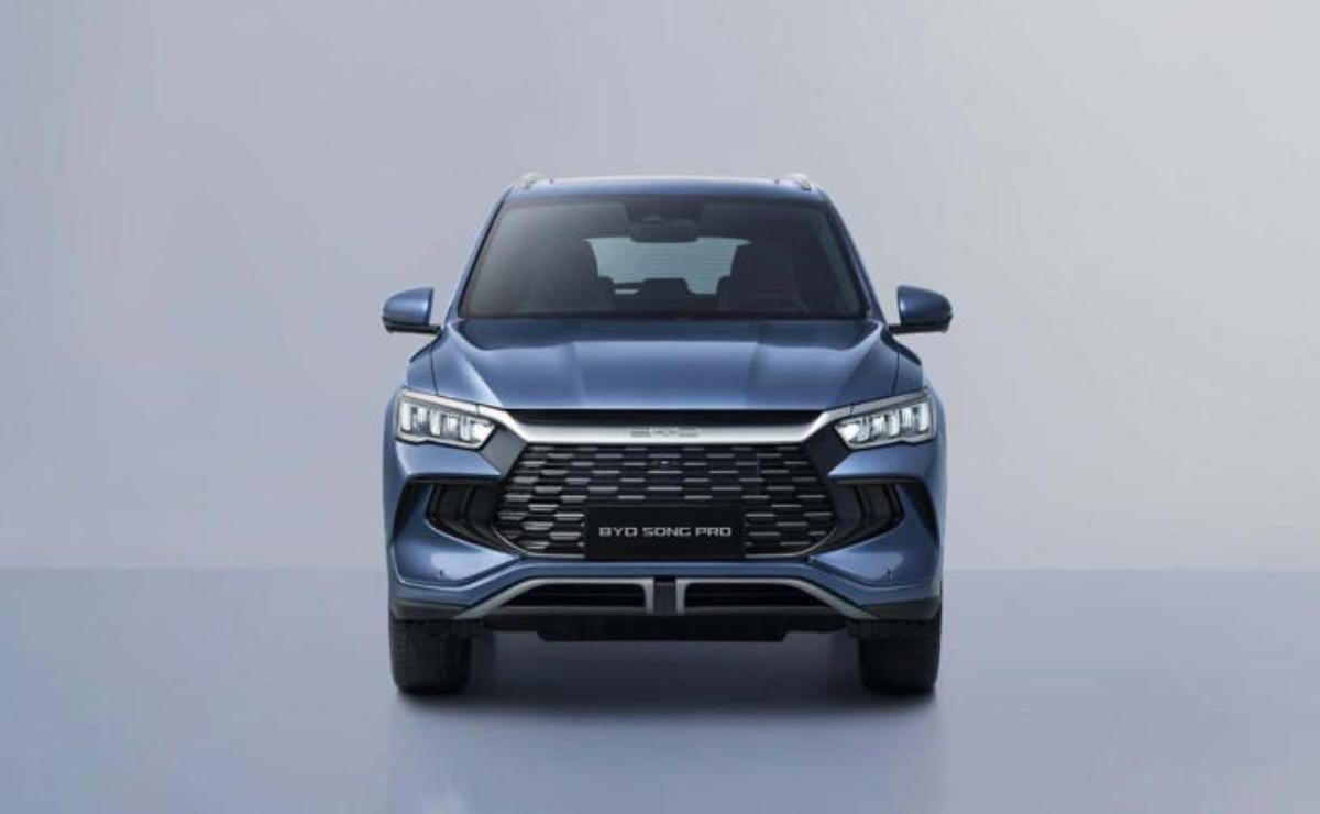 Front view of a sleek blue SUV with modern headlights and a bold grille.