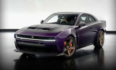 A sleek purple Dodge Challenger with orange brake calipers.