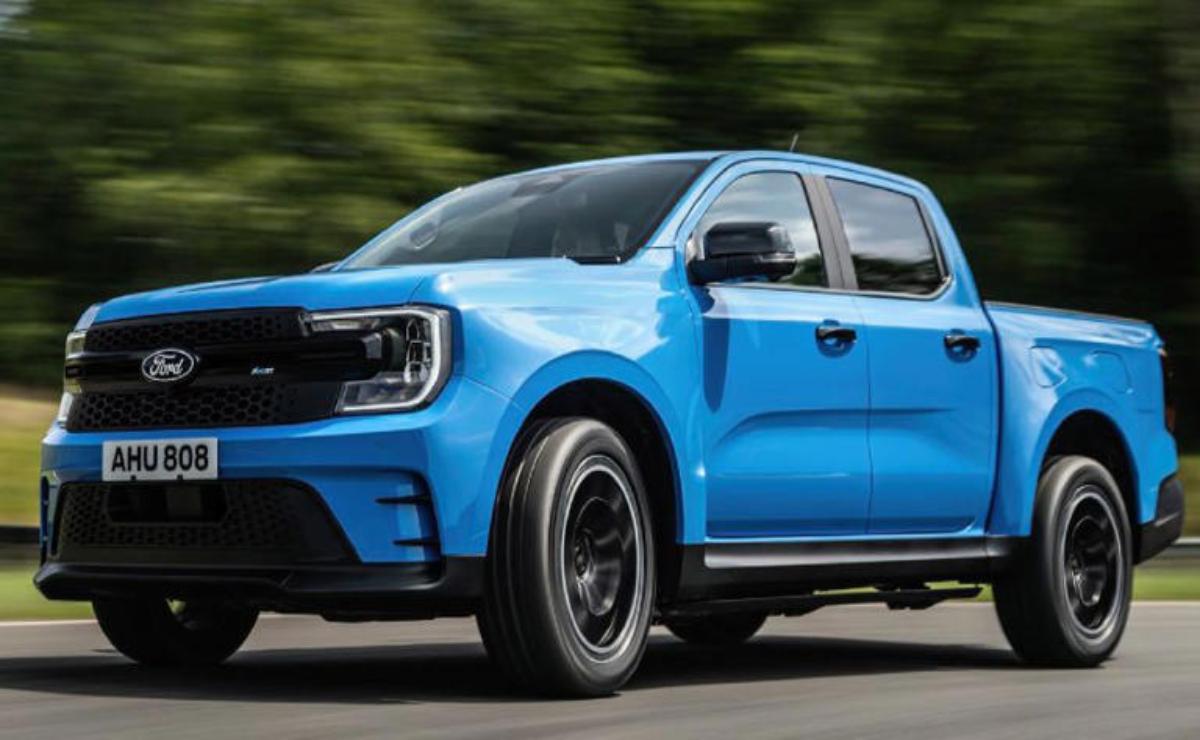 Blue electric pickup truck driving on a road.
