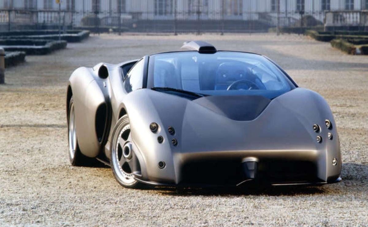 Sleek, futuristic black sports car with a unique aerodynamic design.