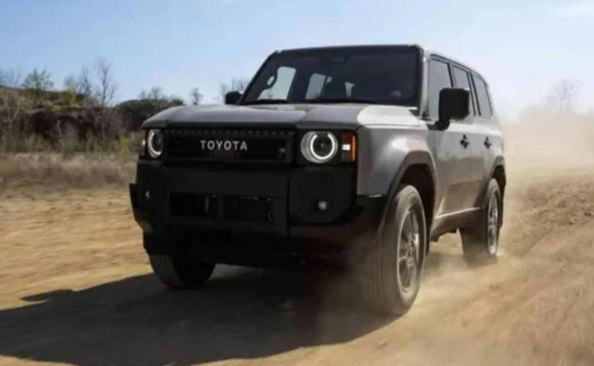 A rugged Toyota SUV driving on a dusty road.