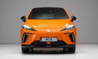 Front view of an orange MG4 electric car with sleek, modern design.