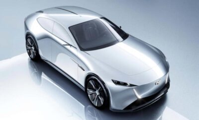 Sleek silver futuristic sports car with aerodynamic design and tinted windows.