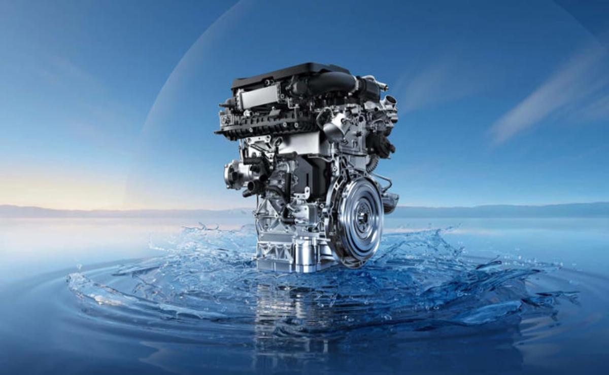 A modern engine floating on water under a clear sky.