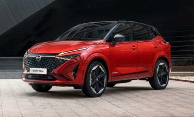 Sleek red modern SUV with black accents and sharp design.