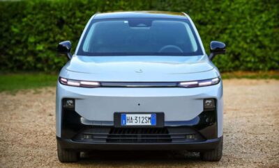 Front view of a sleek, modern electric car with a white and black design.