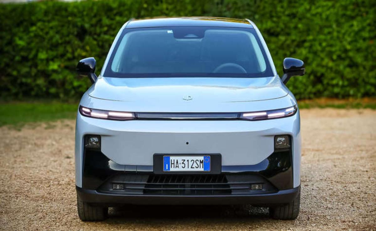 Front view of a sleek, modern electric car with a white and black design.