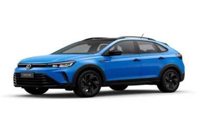 Blue modern compact SUV with black wheels and roof rails.