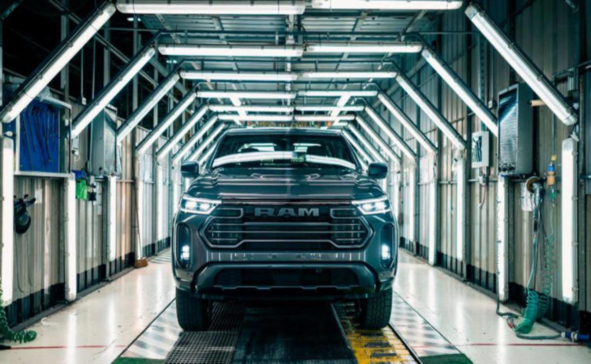 A black Ram pickup truck in a futuristic industrial setting.