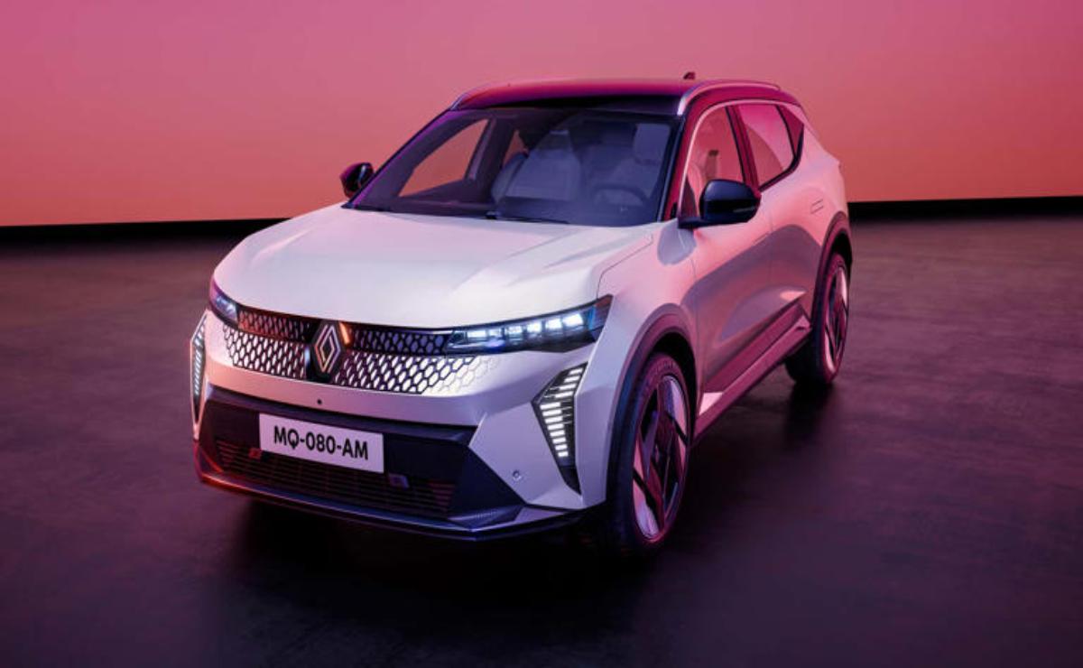 Modern white electric SUV under pink and purple lighting.