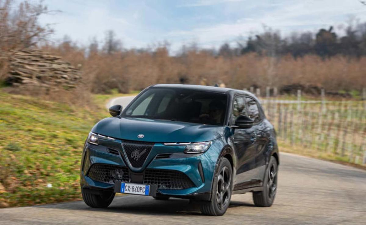 A sleek blue Alfa Romeo SUV parked outdoors on a cloudy day.
