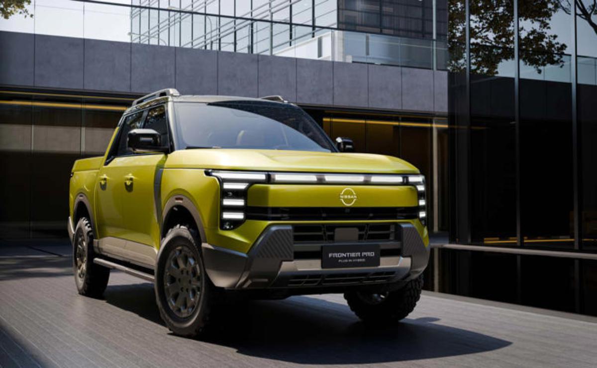 A modern green SUV parked outdoors in front of a building.
