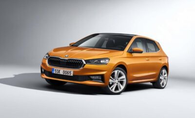 A sleek orange Volkswagen Polo hatchback with a modern design.