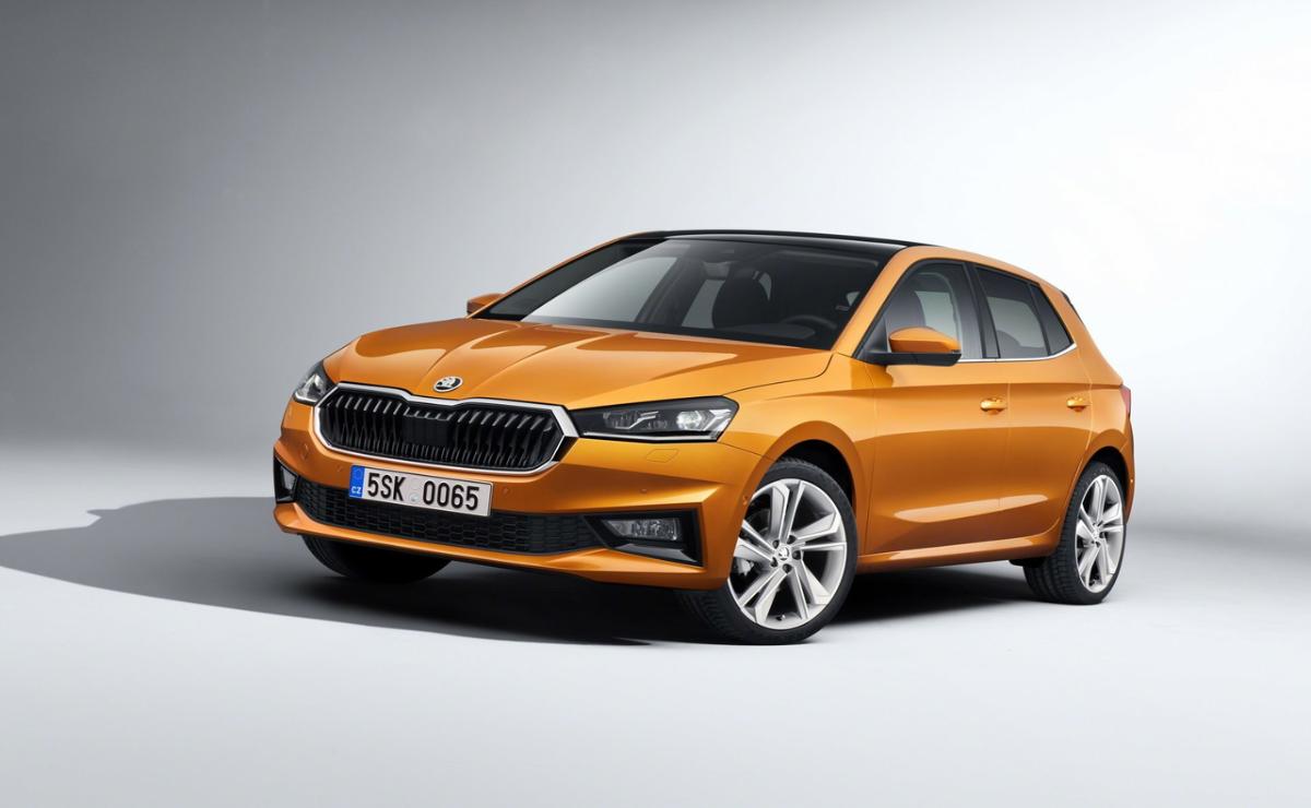 A sleek orange Volkswagen Polo hatchback with a modern design.